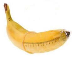 banana in a condom imitates an enlarged cock